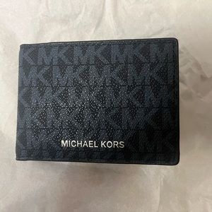 Michael Kors small men's wallet. Black with blue MK lettering.